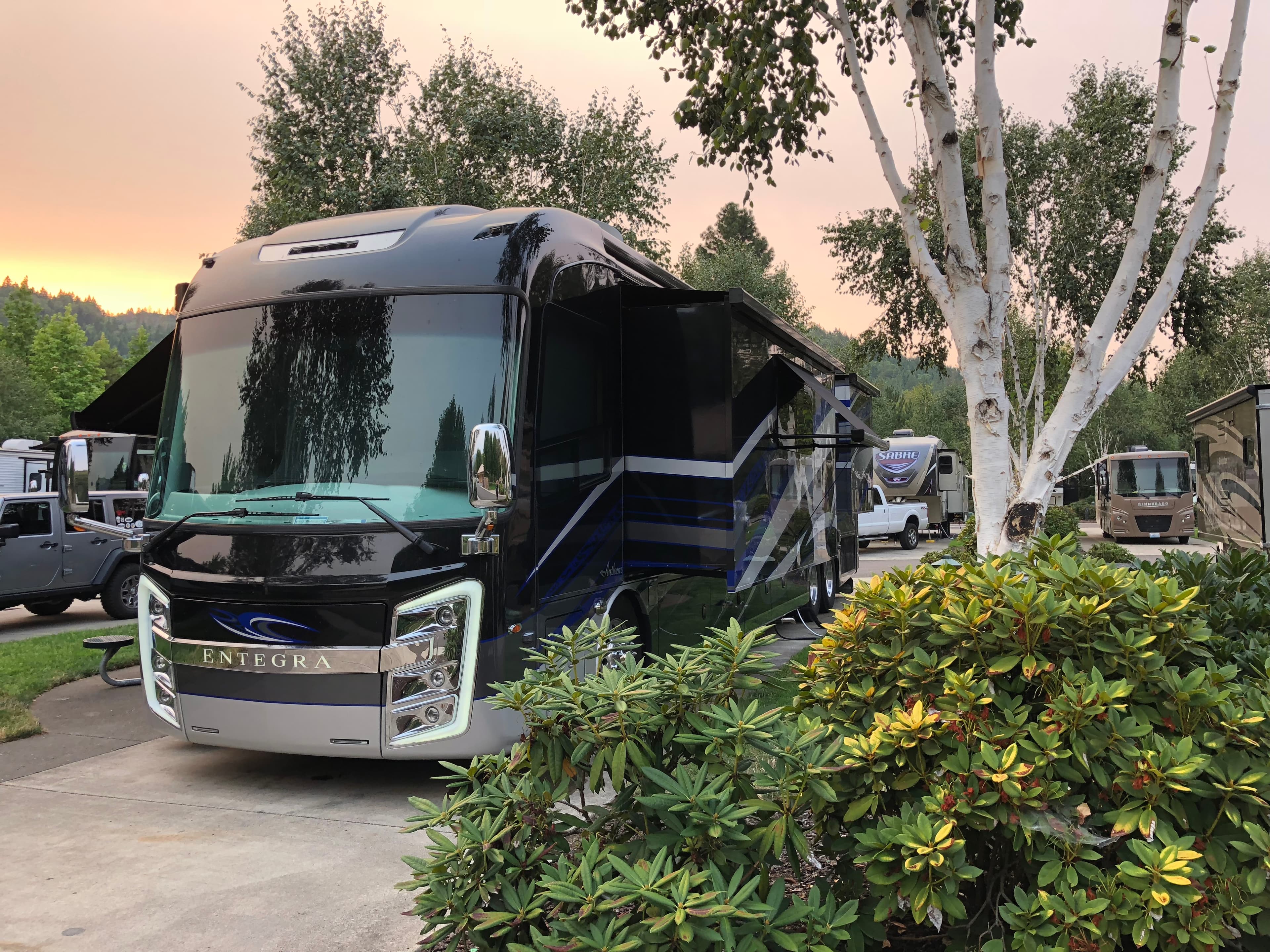 Hero image of an RV parked at an RV lot